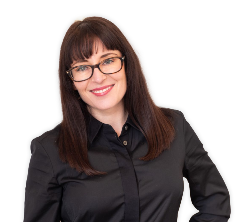 Sex and Relationship Expert Lauren Muratore smiling wearing a black dress with a collar and glasses with no background.